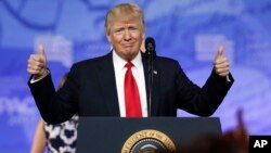 President Donald Trump gives thumbs up as he arrives to speak at the Conservative Political Action Conference, Feb. 24, 2017, in National Harbor, Maryland.