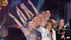 FILE - In this Nov. 29, 2017, file photo, Savannah Guthrie, right, and Hoda Kotb appear with the Rockettes during the 85th annual Rockefeller Center Christmas Tree lighting ceremony in New York. NBC News opened the new year by appointing Kotb as co-anchor of the “Today” show’s first two hours with Guthrie, replacing Matt Lauer following his firing on sexual misconduct charges in late November. 