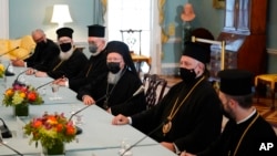 Ecumenical Patriarch Bartholomew I, center, the spiritual leader of the world's Orthodox Christians, speaks during a meeting with Secretary of State Antony Blinken, Oct. 25, 2021, at the U.S. State Department in Washington. 