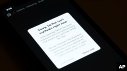 A message reading "Sorry, TikTok isn't available right now" is displayed from the TikTok app on a cell phone screen, Jan. 18, 2025, in Los Angeles. 