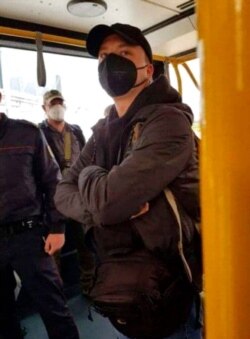 Belarusian journalist Raman Pratasevich stands in an airport bus in the international airport outside Minsk, Belarus, May 23, 2021, in this photo released by Telegram Chanel t.me/motolkohelp. He was arrested shortly thereafter.