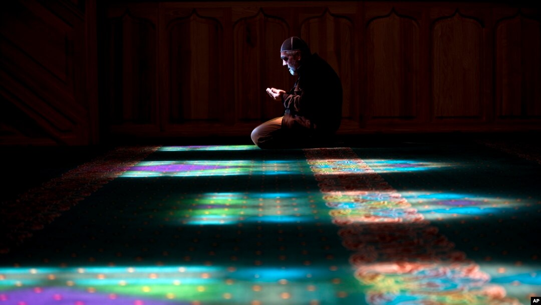 A Crimean Tatar man prays at a mosque in Bakhchysarai, Ukraine, March 10, 2014. 