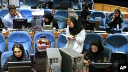 FILE - Iranian journalists follow the country's parliamentary runoff elections at the Interior Ministry in Tehran, Iran, April 29, 2016.