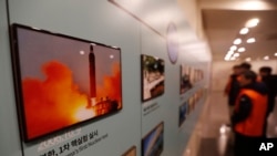 A photo showing North Korea's missile launch is displayed at the Unification Observation Post in Paju, South Korea, near the border with North Korea, Dec. 13, 2019. 