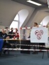 Kosovo electoral commission staff sit at a polling station in the town of Zvecan on April 21, 2024.