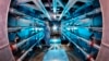 In this 2012 image provided by Lawrence Livermore National Laboratory, a technician reviews an optic inside the preamplifier support structure at the Lawrence Livermore National Laboratory in Livermore, California. 