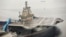 FILE - China's first aircraft carrier, which was renovated from an old aircraft carrier that China bought from Ukraine in 1998, is seen docked at Dalian Port, in Dalian, Liaoning province.
