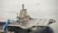 FILE - China's first aircraft carrier, renovated from an old aircraft carrier bought from Ukraine, is shown docked in Dalian, Liaoning province in 2012. A senior U.S. Navy delegation toured the ship this week.