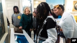 First lady Jill Biden talks to a group of students in the previously off-limits Diplomatic Reception Room as she explains the new features on the day of the unveiling of the new enhanced White House public tour, in Washington, Oct. 21, 2024.