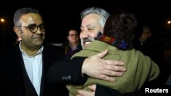 Murat Sabuncu, editor-in-chief of the newspaper Cumhuriyet, is greeted by his friends after being released from the prison in Silivri near Istanbul, Turkey, March 10, 2018