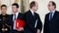 French President Francois Hollande (R) speaks with Justice Minister Jean-Jacques Urvoas (C) as Prime Minister Manuel Valls walks by following the weekly cabinet meeting at the Elysee Palace in Paris, Feb. 3, 2016. 