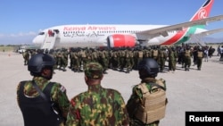 Kenyan police officers arrive at Toussaint Louverture International Airport in Port-au-Prince, Haiti, Jan. 18, 2025. The officers are part of a multinational force that aims to curb gang violence in Haiti.