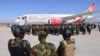 FILE - Kenyan police officers arrive at the Toussaint Louverture International Airport in Port-au-Prince, Haiti, as part of a peace-keeping mission to tackle violence in Haiti, Jan. 18, 2025. 