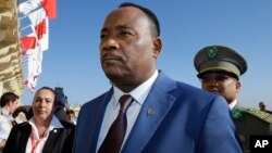 FILE - Niger President Issoufou Mahamadou arrives on the occasion of a summit on migration in Valletta, Malta, Nov. 12, 2015. Election results released Feb. 24, 2016, show he continues to hold a lead in his bid for a second term.