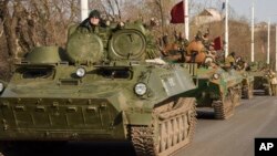 File - Pro-Russia rebels are seen driving in a convoy in Stakhanov, eastern Ukraine, April 2015. 