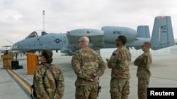 U.S air force personnel stand by an U.S. A-10 aircraft, one of a squadron that arrived at the Kandahar air base, Afghanistan, Jan. 23, 2018.