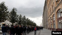 Participants attend a rally in front of the Presidential Administration building in Moscow, in support of Pavel Ustinov, who was sentenced to 3 1/2 years in prison for resisting police, Sept. 18, 2019.