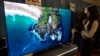 A 249-centimeter TCL QM-8 Q-Class Mini-LED QLED 4K HDR Smart TV is displayed at the Pepcom Holiday Spectacular event, in New York, Oct. 30, 2024.