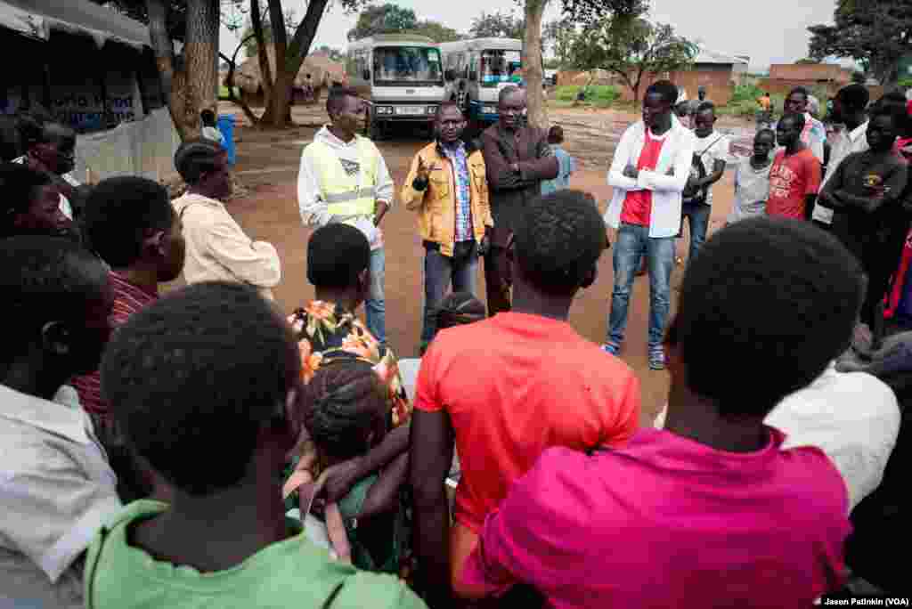 A Ugandan government official briefs newly arrived refugees on the laws of Uganda.