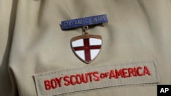 FILE - A detail from the Boy Scout uniform in front of the Boy Scouts of America headquarters in Irving, Texas, Feb. 4, 2013.