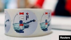 Stickers are seen on a desk at a polling station for the New York state primary election in the Manhattan borough of New York City, April 19, 2016. 