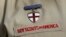 FILE - A detail of a Boy Scout uniform in front of the Boy Scouts of America headquarters in Irving, Texas, Feb. 4, 2013.