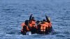 FILE—Migrants travel in an inflatable boat across the English Channel, bound for Dover on the south coast of England. U.K. Prime Minister Rishi Sunak on April 22, 2024, promised to begin deporting asylum seekers to Rwanda in coming months as part of a plan to deter arrivals.