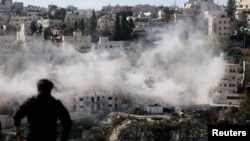 Israeli forces demolish the home of two Hamas gunmen who carried out a deadly shooting attack at a bus stop at the entrance to Jerusalem in November, amid the ongoing conflict between Israel and the Palestinian Islamist group Hamas, in East Jerusalem, Jan. 9, 2024. 