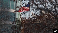 FILE - A U.S. flag flies at the U.S. Embassy in Ankara, Turkey, Feb. 2, 2013.