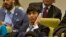 FILE - Shin Dong-Hyuk holds his earpiece as he listens during a meeting of the U.N. General Assembly human rights committee on a proposal to refer North Korea to the International Criminal Court for alleged crimes against humanity, Nov. 18, 2014.