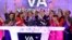 David Cush, third left front row, President & CEO of Virgin America is applauded and showered with confetti as he rings the opening bell at the Nasdaq MarketSite, to mark his company's IPO, in New York, Nov. 14, 2014. 