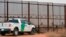 FILE - A U.S. Border Patrol vehicle drives next to a U.S.-Mexico border fence in the New Mexico town of Santa Teresa, Jan. 5, 2016. The Trump administration is preparing to replace existing vehicle barriers along a stretch of the border. The notice published Jan. 22, 2018, in the Federal Register says the area extends around 20 miles west of the Santa Teresa Port of Entry.