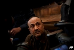 FILE - Senior Fatah leader Marwan Barghouti appears at Jerusalem's court, Jan. 25, 2012.