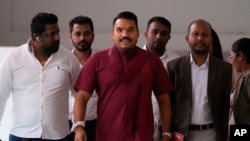 Presidential candidate Namal Rajapaksa arrives for a meeting along with his supporters in Colombo, Sri Lanka, Sept. 5, 2024. 