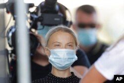 FILE - Climate activist Greta Thunberg arrives for a news conference in Berlin, Germany, Aug. 20, 2020.