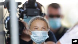 FILE - Climate activist Greta Thunberg arrives for a news conference in Berlin, Germany, Aug. 20, 2020.