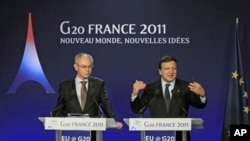 European Commission President Jose Manuel Barroso (r) and European Council President Herman Van Rompuy (l) during a news conference on the second day of the G20 Summit in Cannes, France, November 4, 2011.