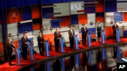 Republican presidential candidates John Kasich, Jeb Bush, Marco Rubio, Donald Trump, Ben Carson, Ted Cruz, Carly Fiorina and Rand Paul appear during Republican presidential debate at Milwaukee Theatre, Tuesday, Nov. 10, 2015, in Milwaukee. (AP Photo/Morry Gash)