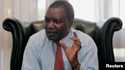 FILE - Kenya's Central Bank Governor Njuguna Ndung'u speaks to Reuters during an interview at his office in Nairobi.