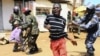 Anti-riot and military policemen disperse supporters of Uganda's Forum for Democratic Change (FDC) leader Kizza Besigye during a protest in Kireka suburb of the capital Kampala, April 18, 2011. Ugandan opposition leader Besigye was charged in court on Mon