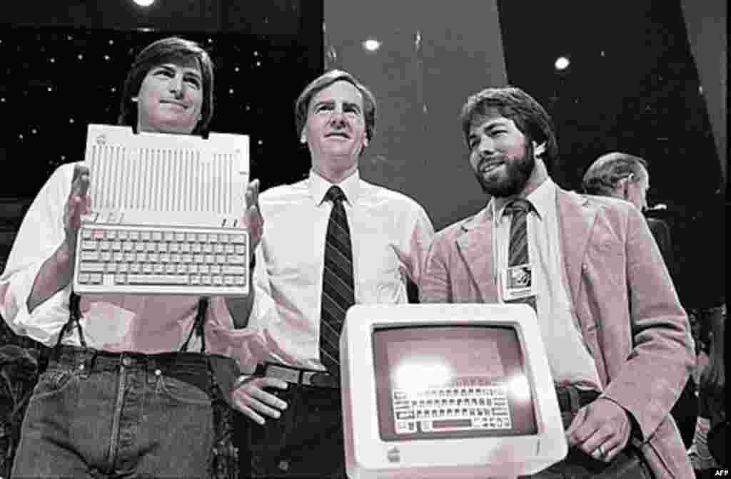 Steve Jobs, left, John Sculley, center, president and CEO of Apple, and Steve Wozniak, co-founder of Apple, unveil the new Apple II computer in San Francisco on April 4, 1984. (AP)