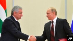 Russia Georgia Russian President Vladimir Putin, right, and leader of Abkhazia Raul Khadzhimba Sochi Russia Nov 24, 2014