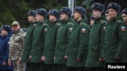 Russian conscripts called up for military service line up before their departure for garrisons, in Bataysk in the Rostov region, Russia, Oct. 20, 2024.