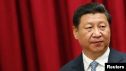 FILE - China's President Xi Jinping attends a meeting at Miraflores Palace in Caracas, Venezuela, July 20, 2014. 