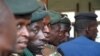 Members of the Burundi military wait at a polling station during a parliamentary election near Burundi's capital Bujumbura, June 29, 2015.