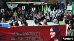 Women protest in the Kurdish-controlled city of Qamishli over the death of Mahsa Amini in Iran September 26, 2022. (REUTERS/Orhan Qereman)