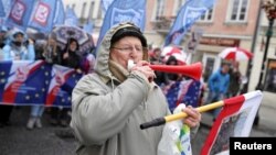 Polish participants march during a protest against planned education reforms in Warsaw, Nov. 19, 2016. Some in Poland are concerned that a new bill will undermine Poles' right to freedom of assembly.