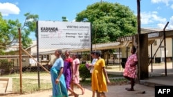 FILE—A group of pregnant women take time out from the maternity ward to walk and exercise at Karanda Mission Hospital in Mount Darwin on March 2, 2024.