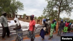 Villagers collect their monthly food ration provided by the United Nations World Food Program (WFP) in Masvingo, Zimbabwe, Jan. 25, 2016.