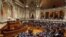 Members of parliament stand up, background right, to vote in favor of a bill that grants adoption rights to same-sex couples at the parliament in Lisbon, Feb. 10, 2016. 
